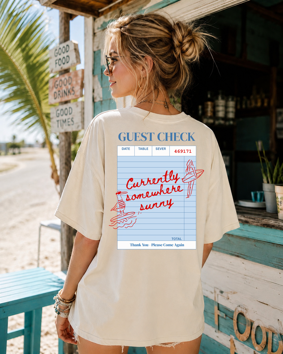Woman wearing a t-shirt with a graphic design on the beach